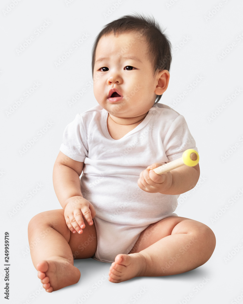 Confused Asian baby girl in a studio Confused Asian baby girl in a studio