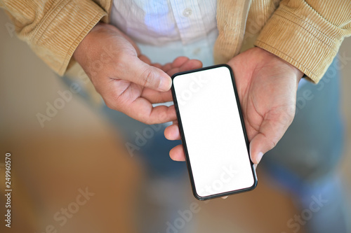 Top view of Man standing and using mobile smart phone