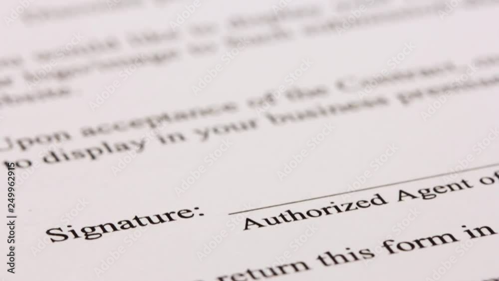 Hand signing a contract in black ink, made up signature or not real sign Hand signing a contract in black ink, made up signature or not real sign