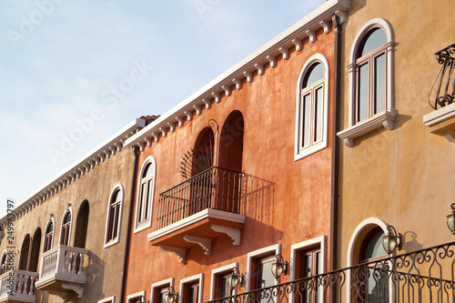 Windows on yellow wall in old house in Venice