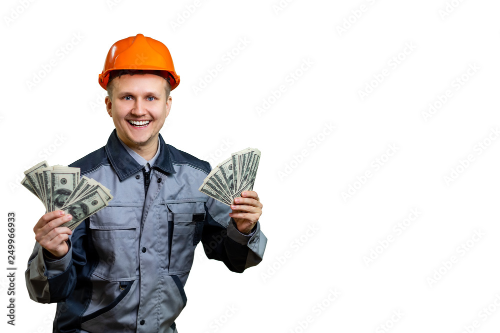 The builder in the orange helmet is incredibly rich. He received a large salary for repair work and now can celebrate. isolated The builder in the orange helmet is incredibly rich. He received a large salary for repair work and now can celebrate. isolated