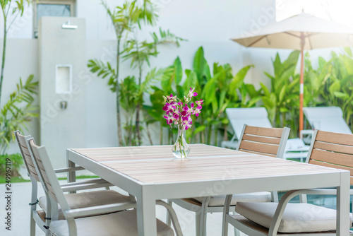 exterior design outdoor table by  and sun bed or sun lounger  with swimming pool 