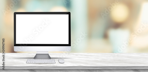 Desktop computer mock up on marble table and blurred soft light table in luxury restaurant with bokeh background. product display template.Business presentation. photo