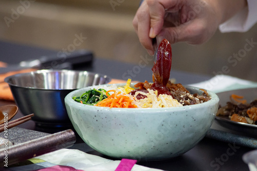 Bibimbap, Traditional Korean cusine bibimbap, Chef preparing Korean food, chef cooking in kitchen