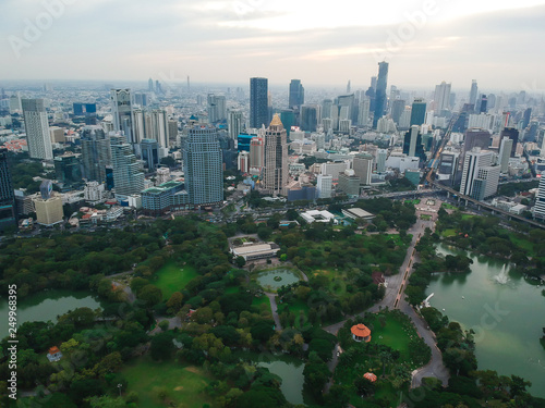 Photography Aerial view city public park with modern building and fog