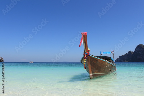Long tail boat and tropical beach on Phi Phi island Thailand 