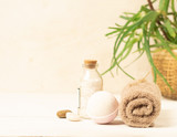 Set for spa treatments soft clean towels salt soap the background tropical plant. Horizontal frame. Selective focus.