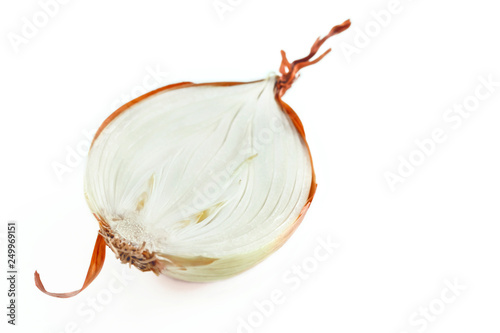 Bulb Onion, Allium cepa, cut in half with visible scale leaves, basal plate, fibrous roots and curly tunic isolated on white background. Healthy Organic Food Ingredients. photo