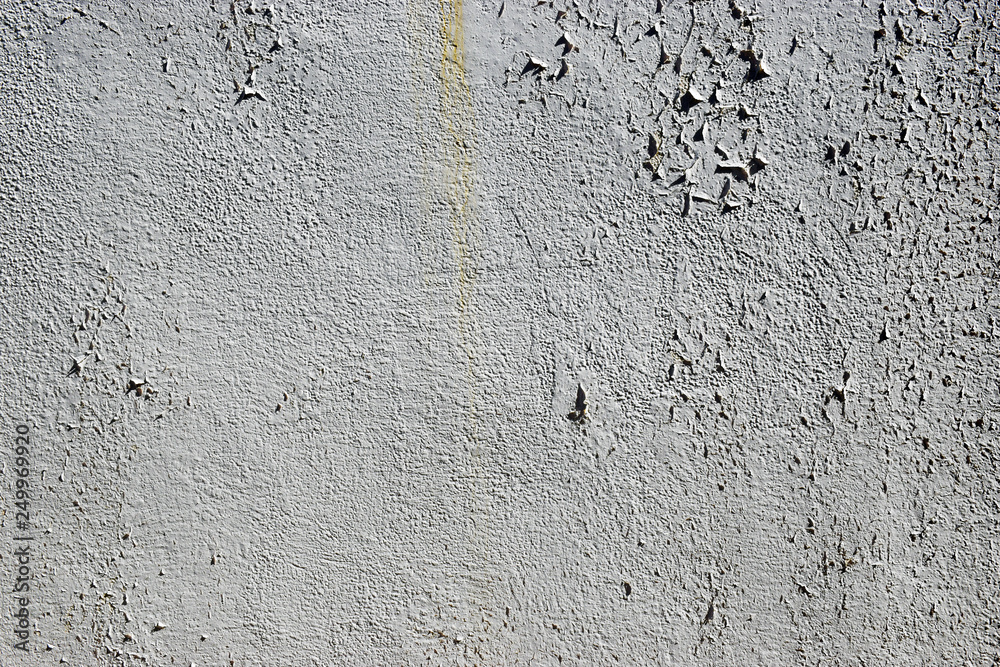 Obraz premium Rough white stone wall with peeling paint grunge vintage texture background