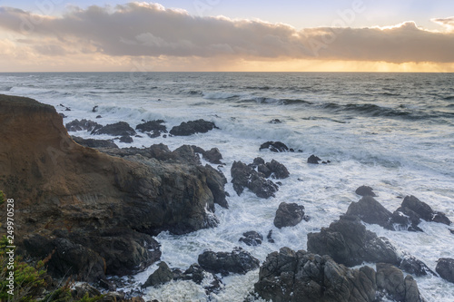 Rugged Coastline with dramatic sky in distance. Montara, San Mateo County, CA