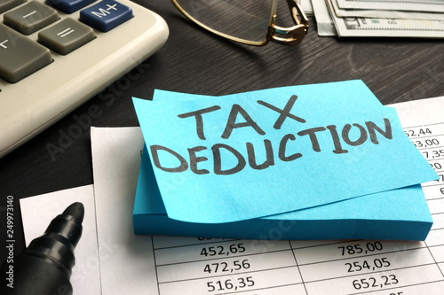 Tax deduction written on a piece of paper. photo