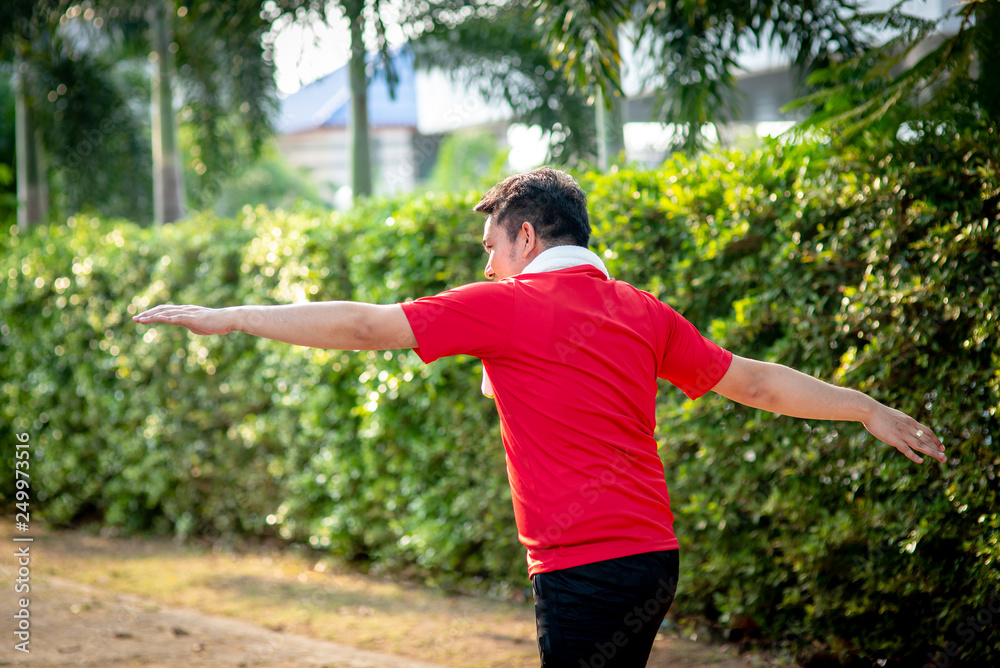 Happy Asian sport man doning exercise in the park outdoor. Happy Asian sport man doning exercise in the park outdoor.