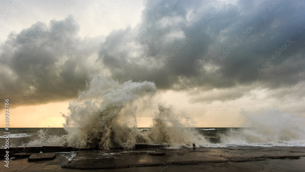 Storm waves over a pier in the Adler, Sochi