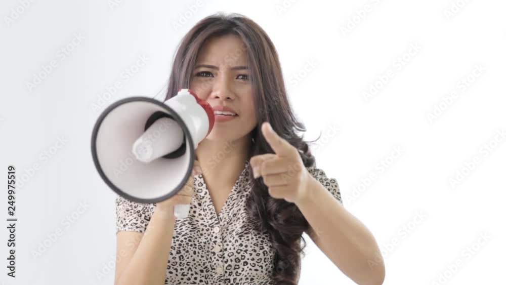 young asian woman shouting using megaphone on white background young asian woman shouting using megaphone on white background