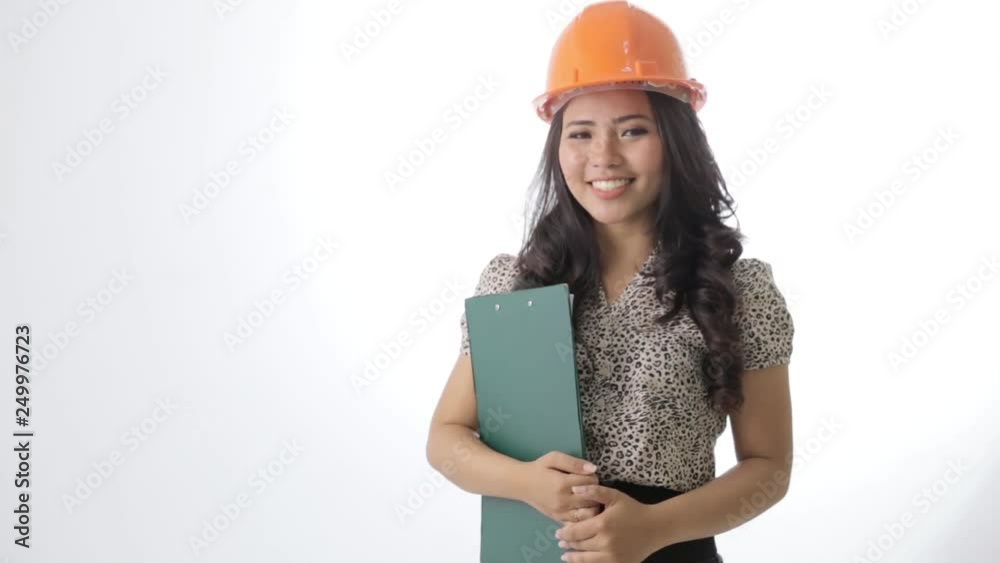happy young asian architect woman wearing hard hat over white background happy young asian architect woman wearing hard hat over white background