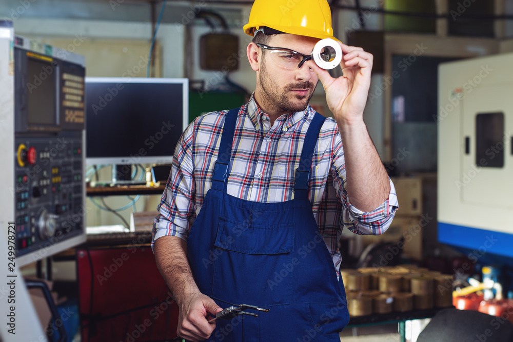 Male worker and quality control inspection in factory Male worker and quality control inspection in factory