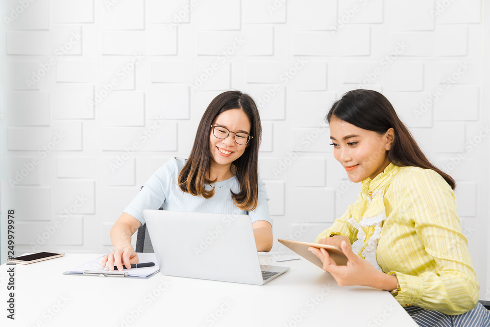 Two Asian architect ladies at office