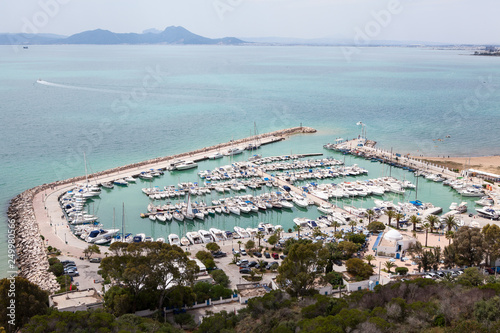 Port of Sidi Bou Said town with yachts and ships. Panorama of shore of the Mediterranean sea in Tunisia, Africa