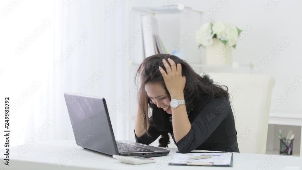 unhappy businesswoman while working in her office unhappy businesswoman while working in her office