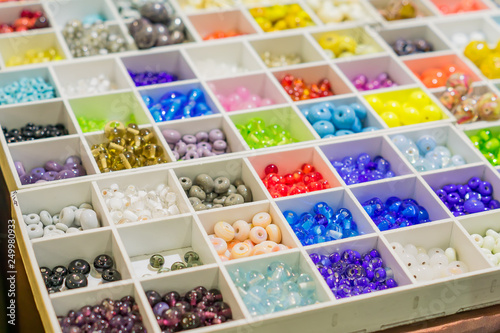 Colorful mix of lampwork glass beads. Variety of shapes and colors to make necklaces or bracelets. DIY materials photo