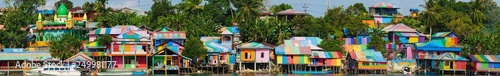Raimbow village at Tual administrative town of Kei Kecil island, Moluccas, Indonesia. A colorful slum on the river bank called Kampung Pelangi. High resolution panorama.