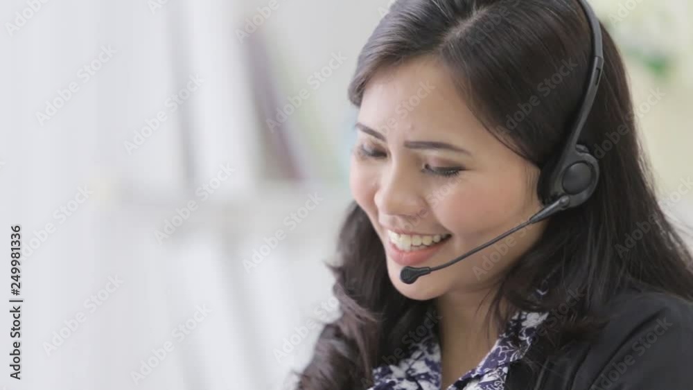 happy smiling call center operator answering phone using headphone happy smiling call center operator answering phone using headphone