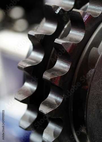 Ccloseup view of engine gear wheels, industrial background photo