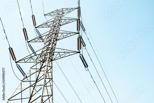 High voltage electricity pylon for electric supply transmission with blue sky, Power distribution technology and generator infracstructure equipment 