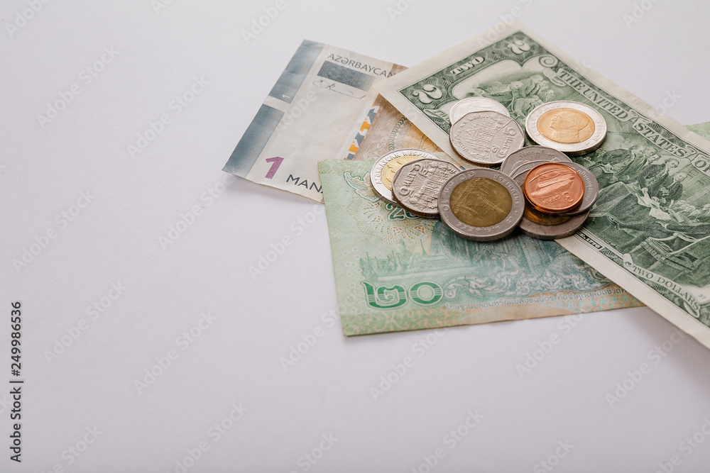 National currency of different countries. Banknotes and coins. The Thai currency, Azerbaijan currency, U.S. dollars. National currency of different countries. Banknotes and coins. The Thai currency, Azerbaijan currency, U.S. dollars.