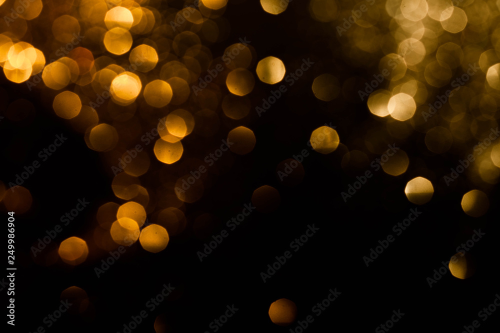 Magic lights christmas bokeh on black background. Can be used for your photos.