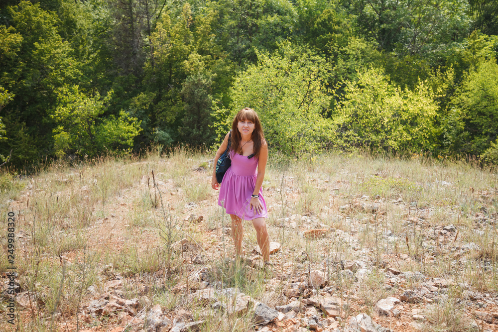 A girl in a short pink dress in a sunny Crimea A girl in a short pink dress in a sunny Crimea