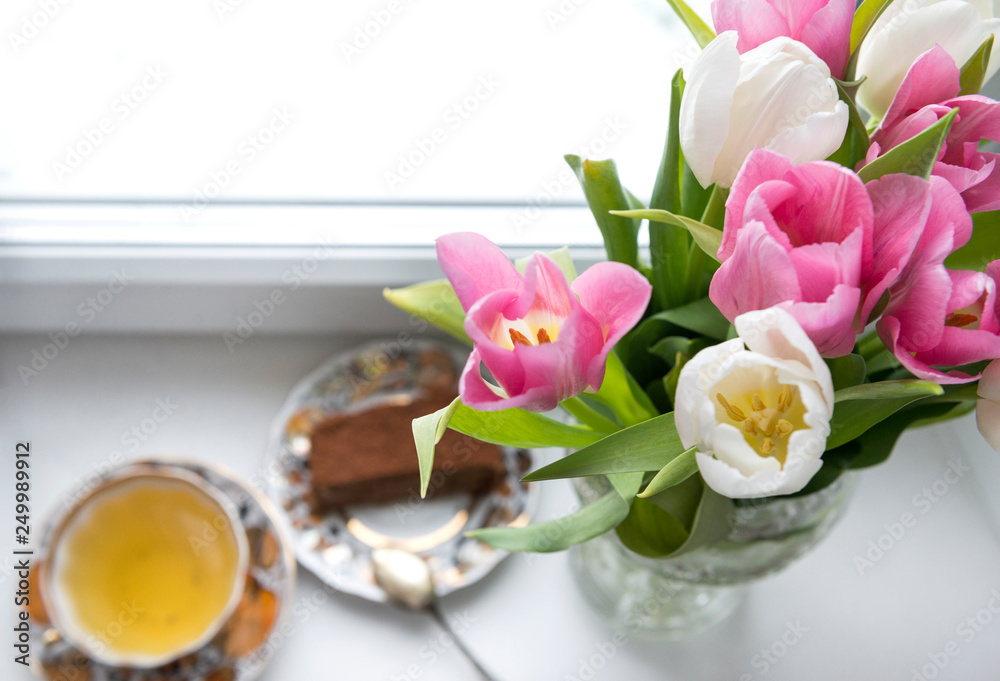 bouquet of tulips, pink and white tulips, a Cup of tea