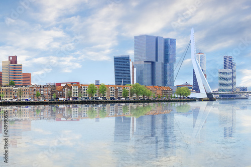 Waterfront panorama of Erasmus bridge across new meuse, theatre, headquaters, port center of Rotterdam