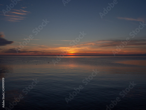 Sunset on the water. Horizontal landscape.