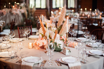 rustic wedding decorations with flowers and candles. banquet decor. picture with soft focus