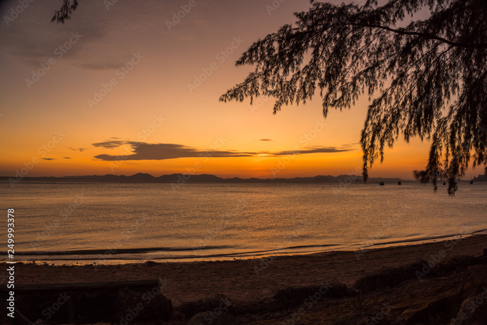 sunset at Kwang beach or deer beach there have a small island name Kwang island in the middle of Kwang beach in Krabi Thailand sunset at Kwang beach or deer beach there have a small island name Kwang island in the middle of Kwang beach in Krabi Thailand