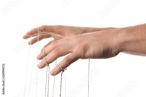 Hands of puppeteer on white background