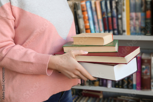Young woman with books in l...