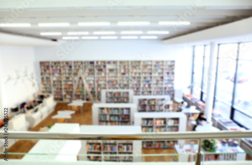 Interior of modern library, blurred view © Pixel-Shot