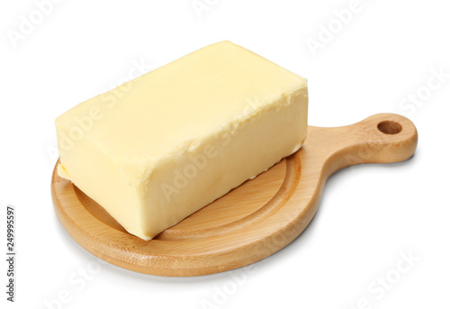 Board with butter on white background