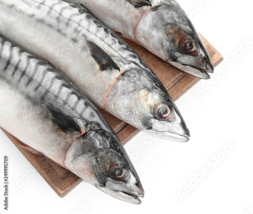 Wooden board with tasty raw mackerel fish on white background