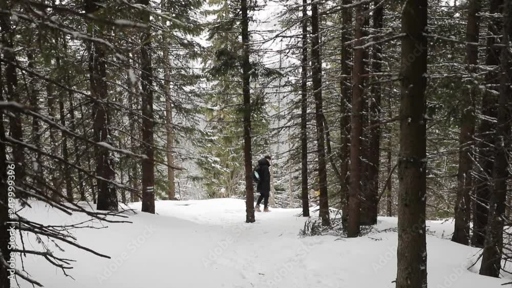 Two photographers are travelling through the winter mountains Two photographers are travelling through the winter mountains