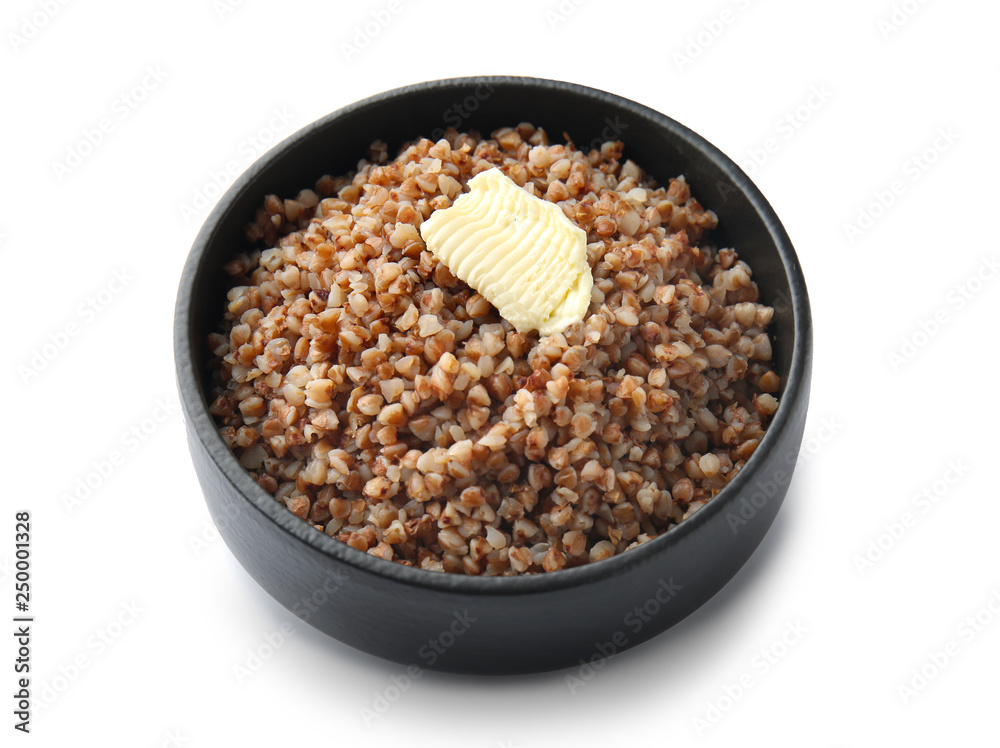 Bowl with tasty boiled buckwheat on white background