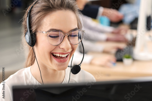 Female technical support agent working in office