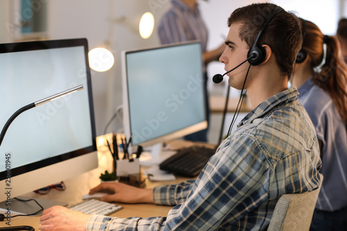 Technical support agents working in office