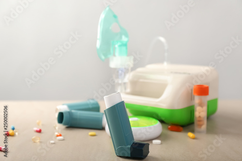 Inhalers with pills on table