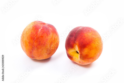 Group of ripe peach fruit isolated on white background.