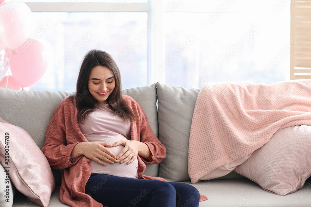 Obraz premium Beautiful pregnant woman resting at home