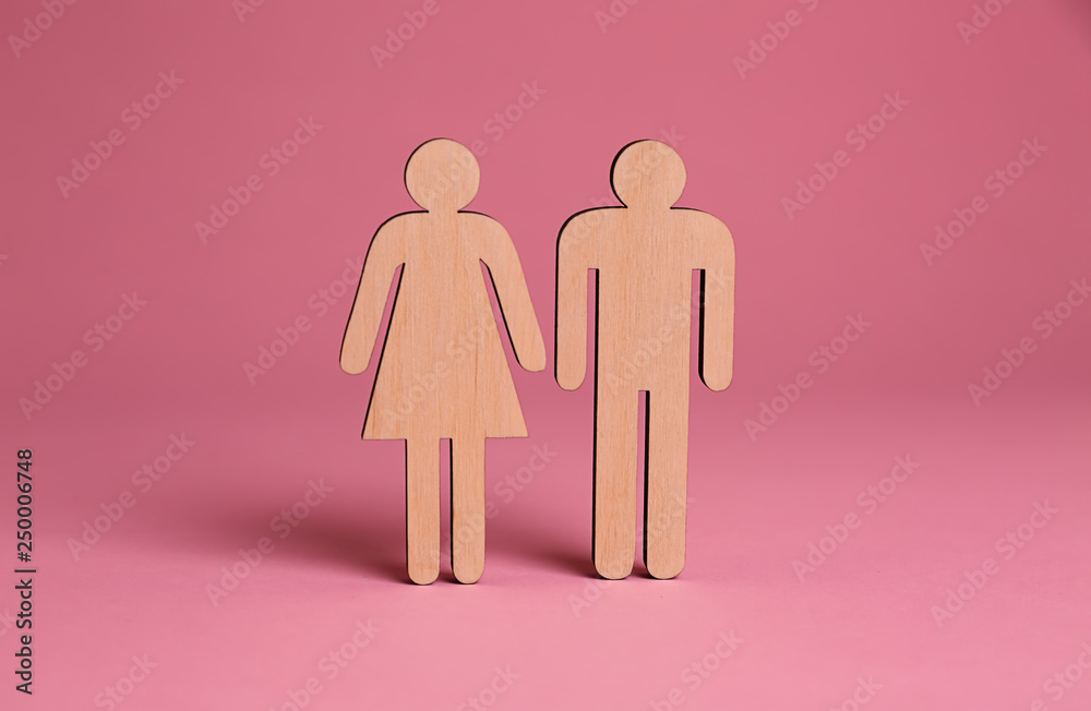 Female and male figures on color background. Concept of transgender Female and male figures on color background. Concept of transgender