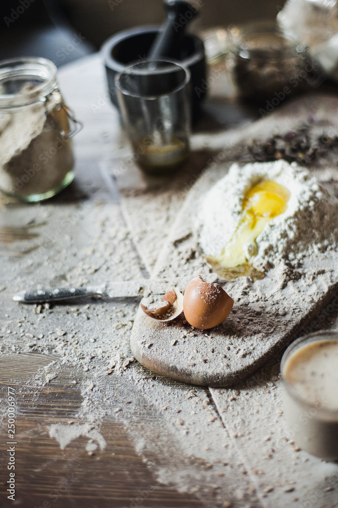 Preparation of the dough on a wooden background Preparation of the dough on a wooden background